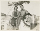 Image of Miriam and Himoe sitting on the wheel box of the Bowdoin